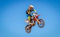 Motocross Rider Jumps high into the Sky
