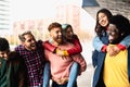 Young multi ethnic friends having fun together hanging out in the city Royalty Free Stock Photo