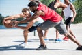 Young multicultural men playing basketball on court Royalty Free Stock Photo