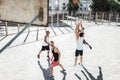 Young multicultural men playing basketball on court Royalty Free Stock Photo