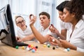 young multicultural students picking molecular model Royalty Free Stock Photo