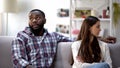 Young multiethnic couple arguing at home, misunderstanding in relations conflict Royalty Free Stock Photo