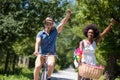 Young multiethnic couple having a bike ride in nature Royalty Free Stock Photo