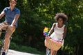 Young multiethnic couple having a bike ride in nature Royalty Free Stock Photo