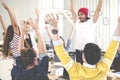 Young multiethnic diverse creative asian group huddle and high five hands together in office workshop with success or empower Royalty Free Stock Photo