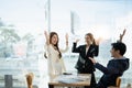 Young multiethnic diverse creative asian group huddle and high five hands together in office workshop with success or Royalty Free Stock Photo