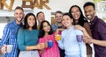 Young multiethnic group of friends portrait celebrating breakfast and coffee in a hotel sky bar having fun together at restaurant Royalty Free Stock Photo