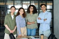 Young multiracial business people team standing in office. Group portrait