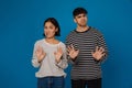 Young multiracial couple showing stop gesture at camera together Royalty Free Stock Photo