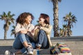 Young multiracial couple women and laughing Royalty Free Stock Photo