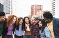 Young multiracial friends having fun together hanging out in the city Royalty Free Stock Photo