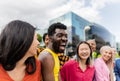 Young multiracial friends having fun together hanging out in the city Royalty Free Stock Photo