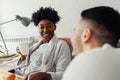 Young multiracial love couple having breakfast in bed Royalty Free Stock Photo