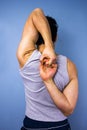 Man stretching arms behind his back Royalty Free Stock Photo