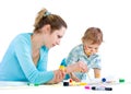 Young mum draws with the son paints Royalty Free Stock Photo