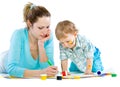 Young mum draws with the son paints Royalty Free Stock Photo