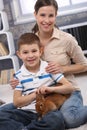 Young mum and son with pet rabbit Royalty Free Stock Photo