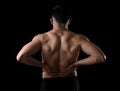 Young muscular body sport man holding sore low back waist with his hands suffering pain Royalty Free Stock Photo