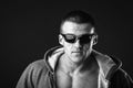 Young muscular man in dark glasses. Royalty Free Stock Photo