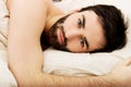 Young muscular man lying in bed. Royalty Free Stock Photo