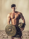 Young muscular man posing in gladiator costume Royalty Free Stock Photo