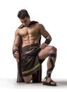 Young muscular man posing in gladiator costume Royalty Free Stock Photo