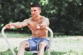 Young muscular man practicing rowing Royalty Free Stock Photo