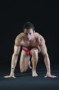 Young muscular man ready to sprint and run Royalty Free Stock Photo