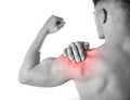 Young muscular sport man holding sore shoulder in pain touching massaging in workout stress