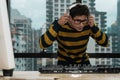 Young music DJ with headphone playing turntable control music mixing