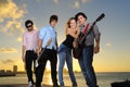 Young musical band posing outdoors Royalty Free Stock Photo