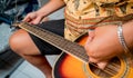 Young musician changing strings on a classical guitar in a guitar shop Royalty Free Stock Photo
