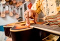 Young musician changing strings on a classical guitar in a guitar shop Royalty Free Stock Photo