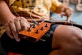 Young musician changing strings on a classical guitar in a guitar shop Royalty Free Stock Photo