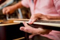 Young musician changing strings on a classical guitar in a guitar shop Royalty Free Stock Photo