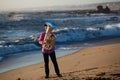 Young lone musician playing the tuba on the sea coast Royalty Free Stock Photo