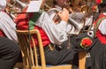 Young musician in typical costume during an autumn local celebration in Val di Funes ( South Tyrol )