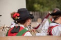 Young musician in typical costume during an autumn local celebration in Val di Funes South Tyrol