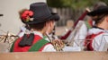 Young musician in typical costume during an autumn local celebration in Val di Funes South Tyrol