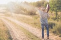 Young man with acoustic guitar over his shoulder Royalty Free Stock Photo