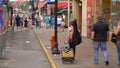 Young musician walking on Nashville Broadway - NASHVILLE, UNITED STATES - JUNE 17, 2019 Royalty Free Stock Photo