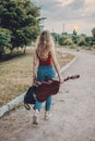 Young Musicians, aspiring musicians, young professional artists, music performing, composer. Young blonde woman with Royalty Free Stock Photo