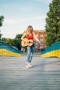 Young Musicians, aspiring musicians, young professional artists, music performing, composer. Young blonde woman with Royalty Free Stock Photo