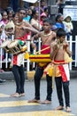 Young musicians perform along the streets of Kandy during the Day Perahera in Sri Lanka.