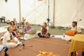 Young musicians playing Indian musical instruments for meditation, group of people listening