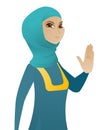 Young muslim business woman showing palm hand.