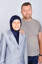 Young muslim couple standing isolated studio