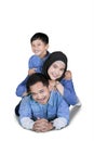 Young Muslim family lying on the floor Royalty Free Stock Photo