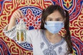 Young Muslim girl celebrating Ramadan while wearing medical mask