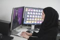 Young muslim girl working on the computer from home